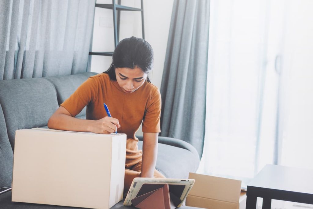 A woman creates a home inventory for insurance purposes as directed by Cal Homes